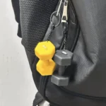 Black dumbbell keychain wtih bag hanging