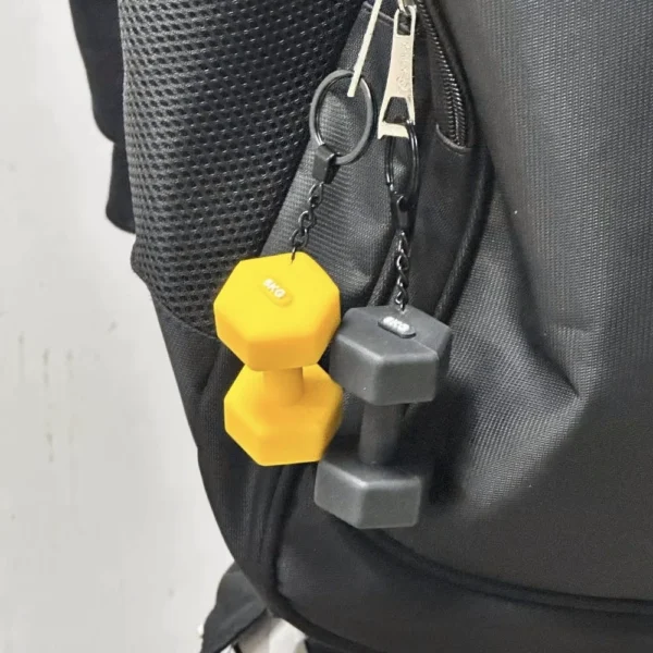 Black dumbbell keychain wtih bag hanging